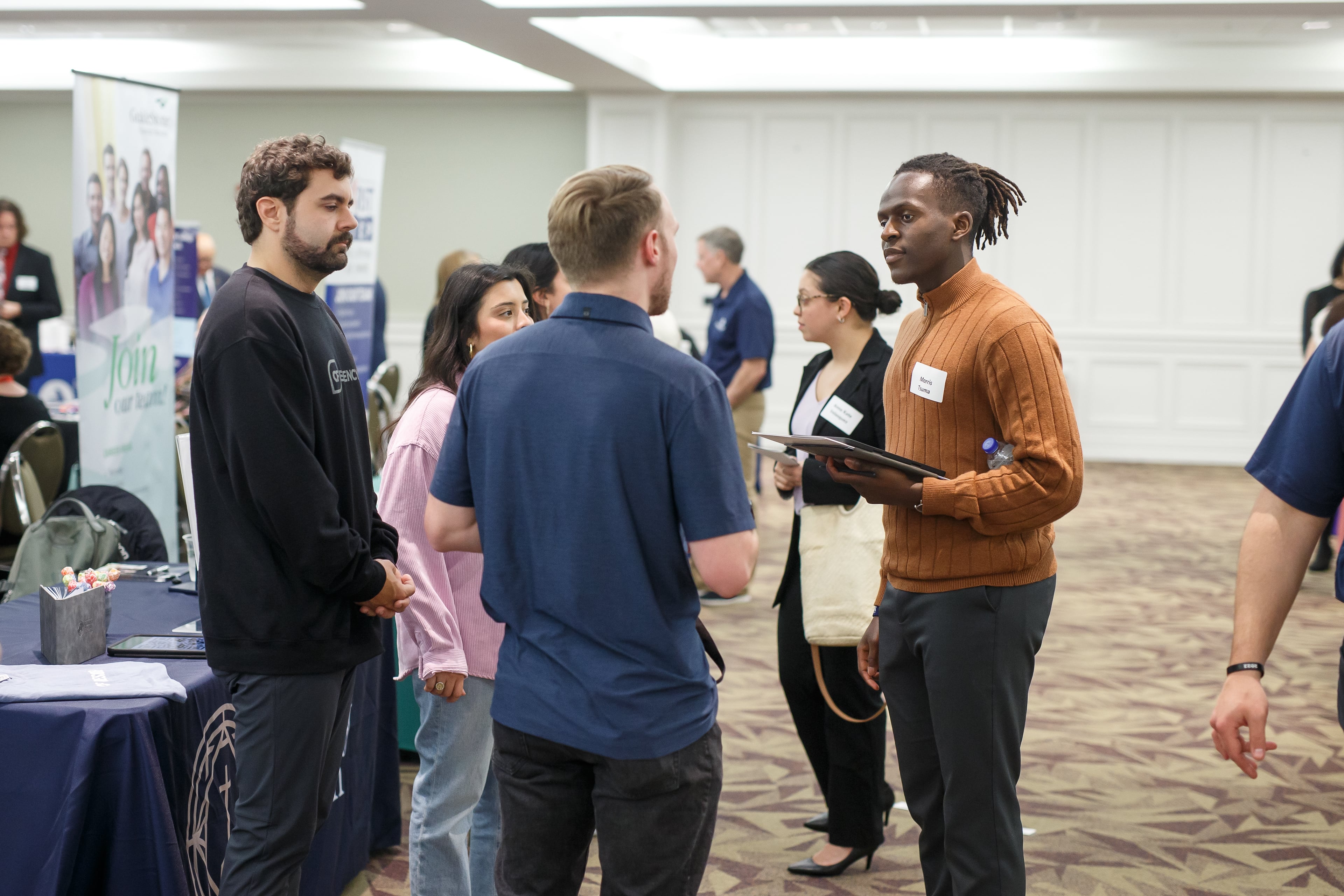 students chat at event