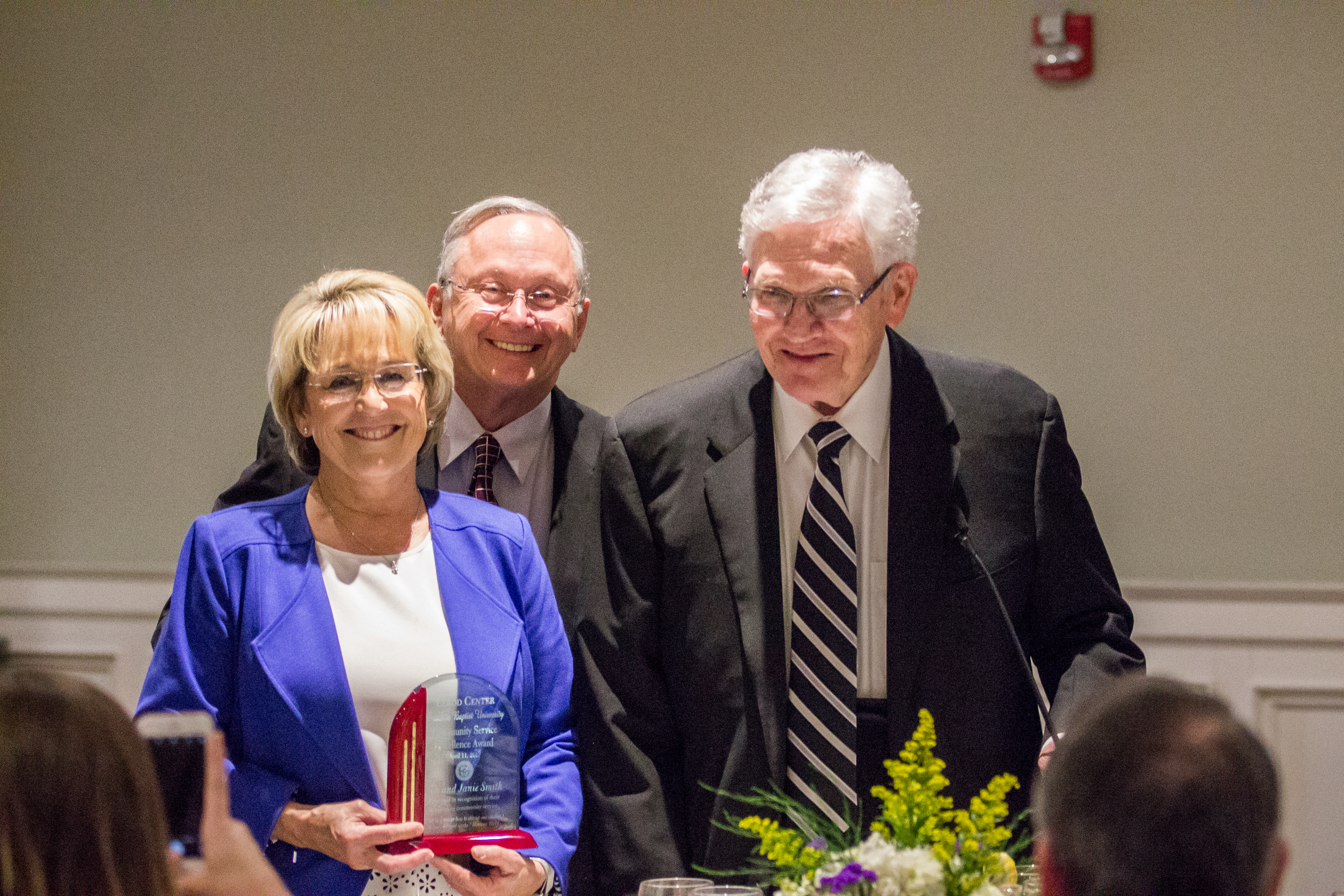 Janie and Jim Smith of Hot Springs were honored with the Community Service Excellence Award by Dr. Ben Elrod, at right.