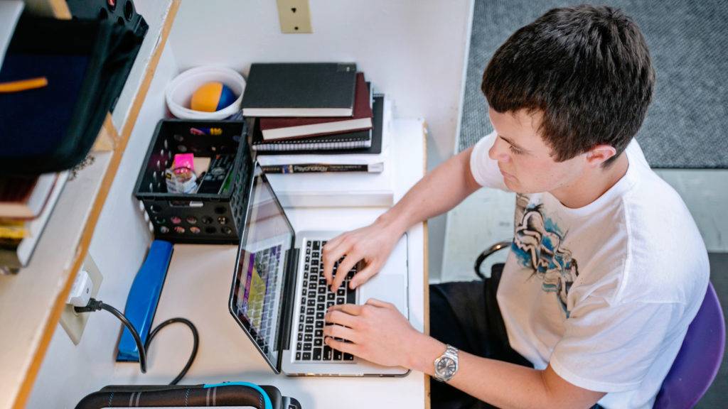 Student surfing the web on his computer