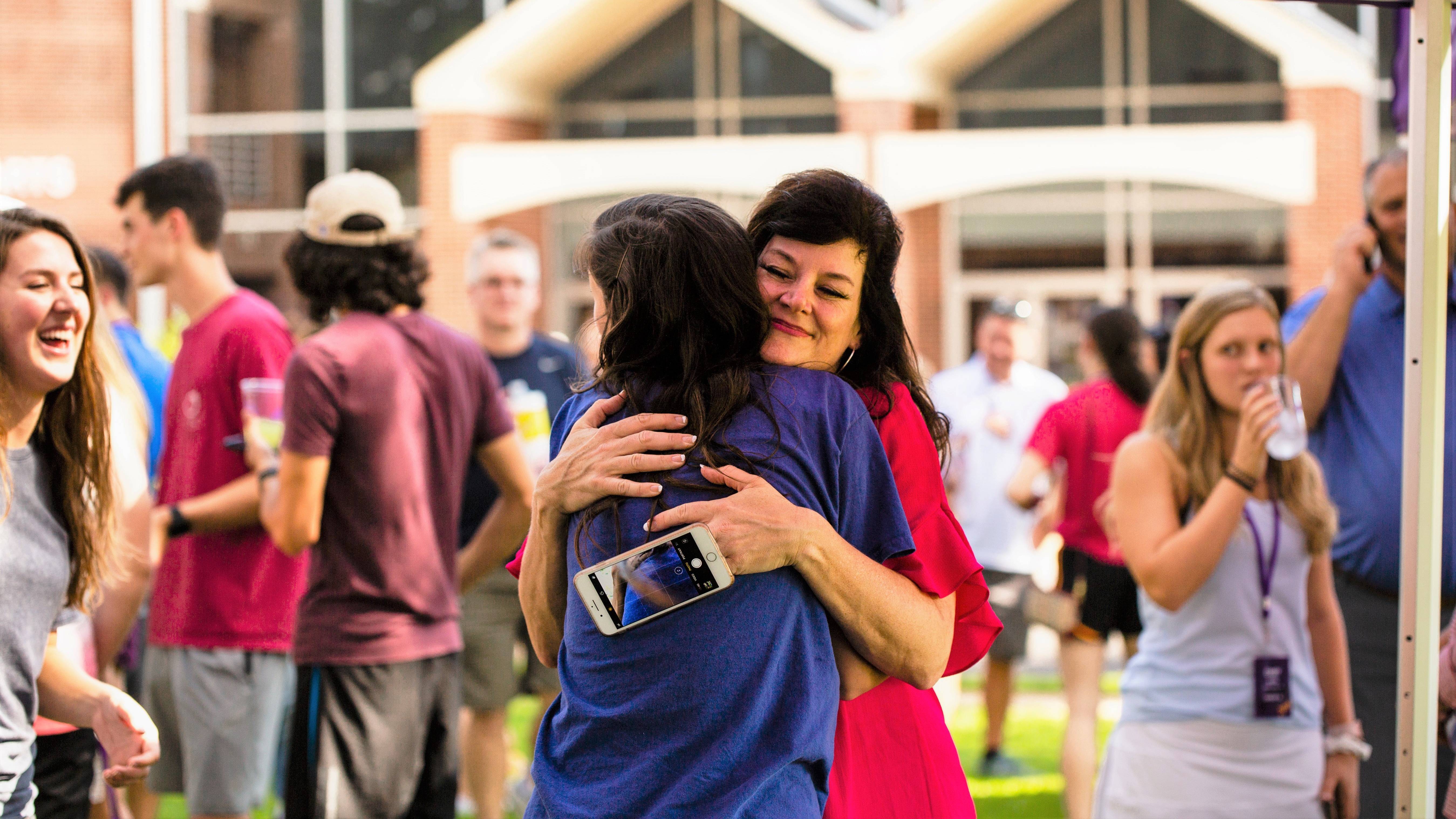 Mother hugs her daughter moving to Ouachita